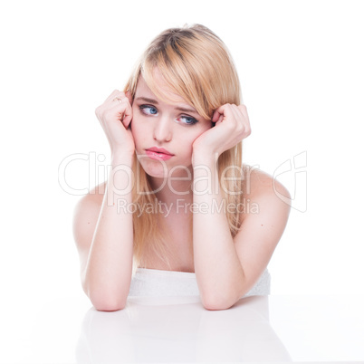 Unhappy Blond Woman with Head in Hands