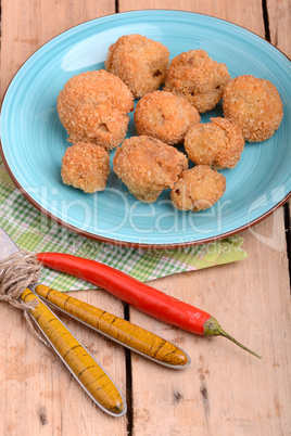 meat chop on blue plate with red pepper