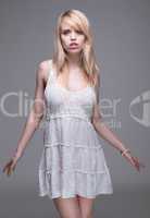 Young Blond Woman Wearing White Sun Dress