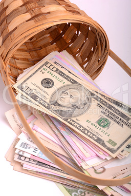 european money on wooden basket, hryvnia, dollars, euro