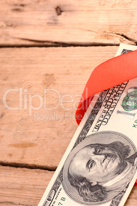 One Hundred Dollar Bills Wrapper in Red Ribbon