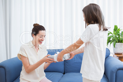 Daughter giving her mother a present