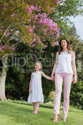 Mother and daughter holding hands