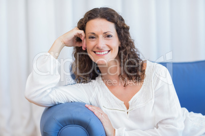 Smiling woman sitting on the couch