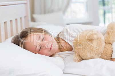 Little girl sleeping in her bed