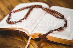 Open bible with rosary beads