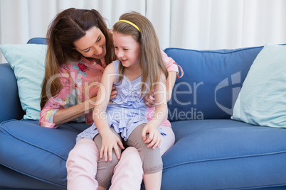 Mother and daughter on the couch
