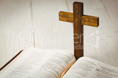 Open bible and wooden cross