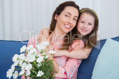 Daughter and mother with flowers