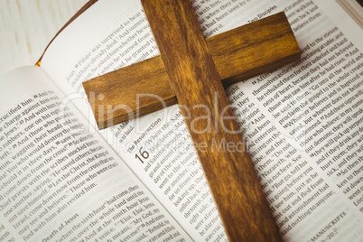 Open bible and wooden cross