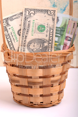 money set in a basket, dollars, euro