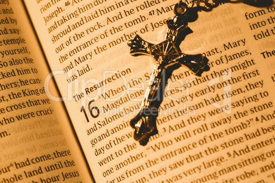 Open bible and silver crucifix