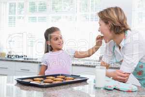 Mother and daughter with hot fresh cookies