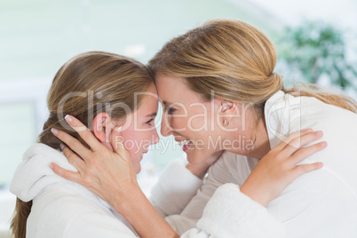 Happy mother and daughter hugging