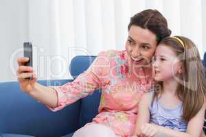 Mother and daughter taking selfie