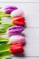 Tulips on wooden table