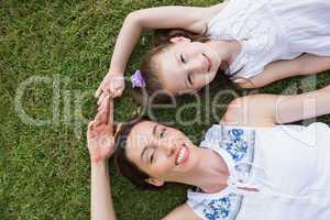 Mother and daughter smiling at camera