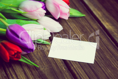 Bunch of tulips and white card