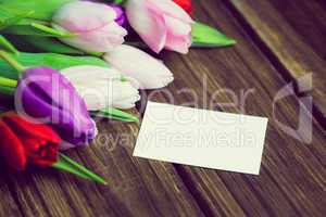 Bunch of tulips and white card