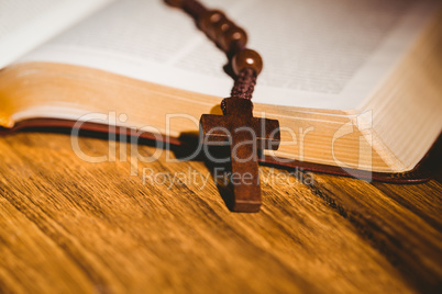 Open bible with rosary beads