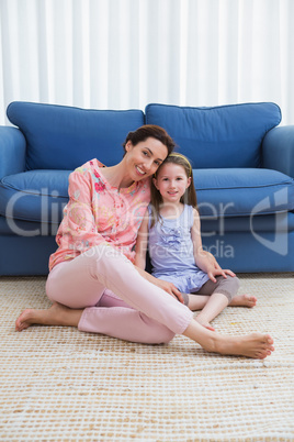 Mother and daughter smiling at camera