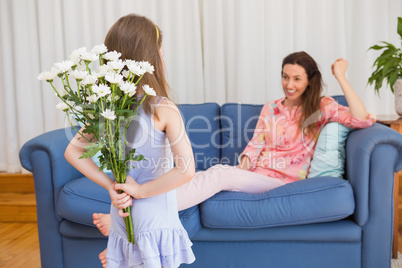 Daughter surprising mother with flowers