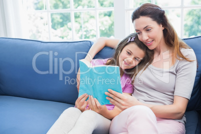 Mother and daughter reading a book