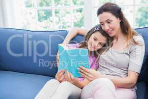 Mother and daughter reading a book