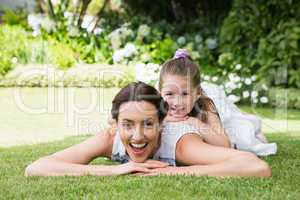 Mother and daughter smiling at camera