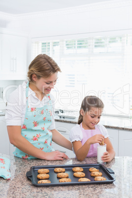 Mother and daughter with hot fresh cookies