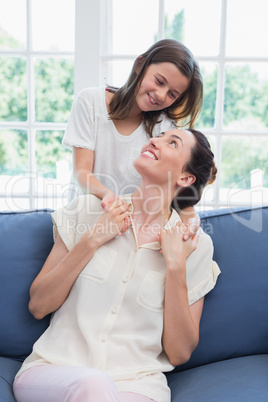 Mother and daughter smiling at each other