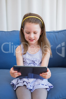 Little girl using tablet pc