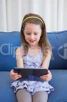 Little girl using tablet pc