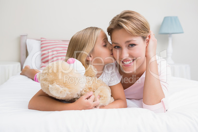 Mother and daughter smiling at camera