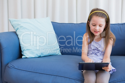 Little girl using tablet pc