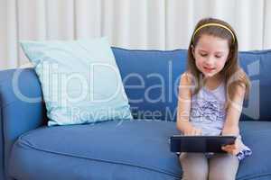 Little girl using tablet pc