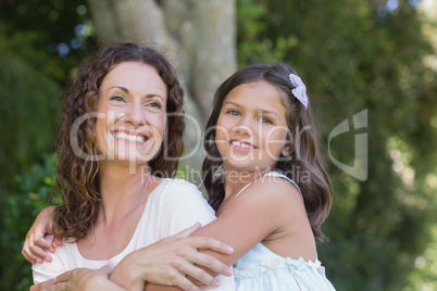 Happy mother and daughter embracing