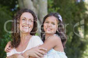 Happy mother and daughter embracing