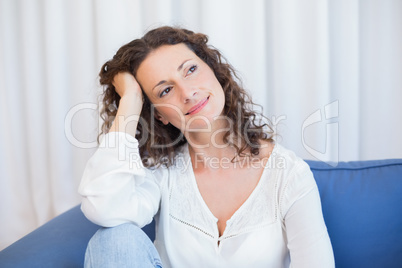 Pretty brunette relaxing on the couch