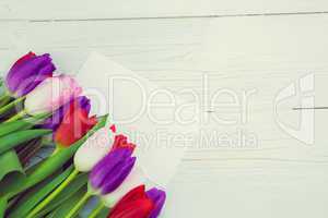 Colorful tulips and white card