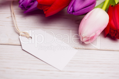 Bunch of tulips and white card