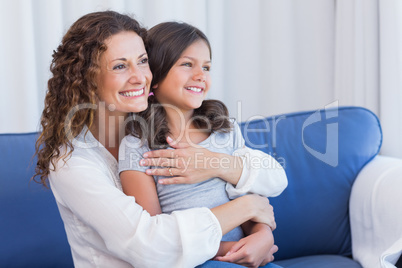 Happy mother and daughter smiling