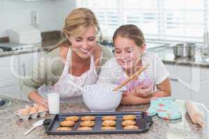 Mother and daughter looking at cookies