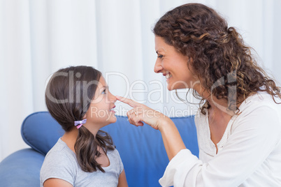 Happy mother and daughter having fun