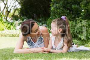 Mother and daughter smiling at each other