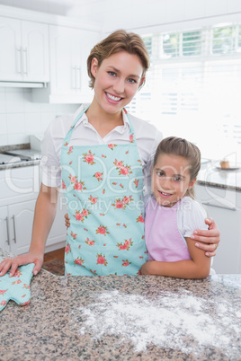 Mother and daughter baking together