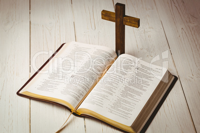 Open bible and wooden cross