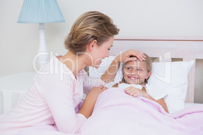 Mother with her daughter at bedtime