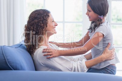 Happy mother and daughter having fun