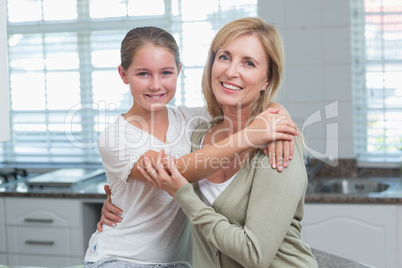 Happy mother and daughter hugging